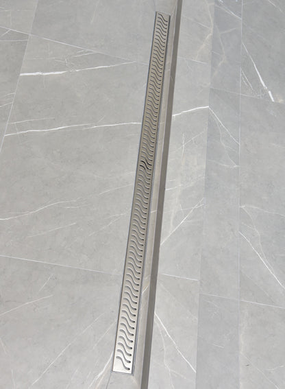 SereneDrains large 59 Inch linear shower drain, brushed stainless steel, Ocean Wave design