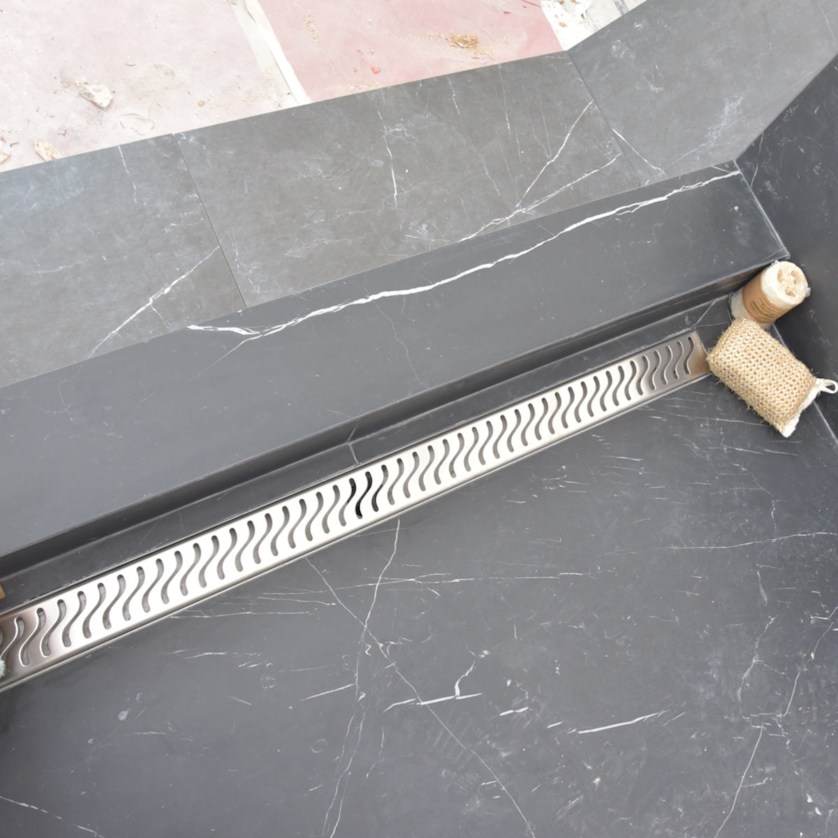 SereneDrains linear shower drain, brushed stainless steel, Ocean Wave design