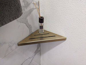 https://www.showerdrainsshop.com/cdn/shop/products/WallMountedSatinGold9ShowerShelf_300x300.jpg?v=1662844729